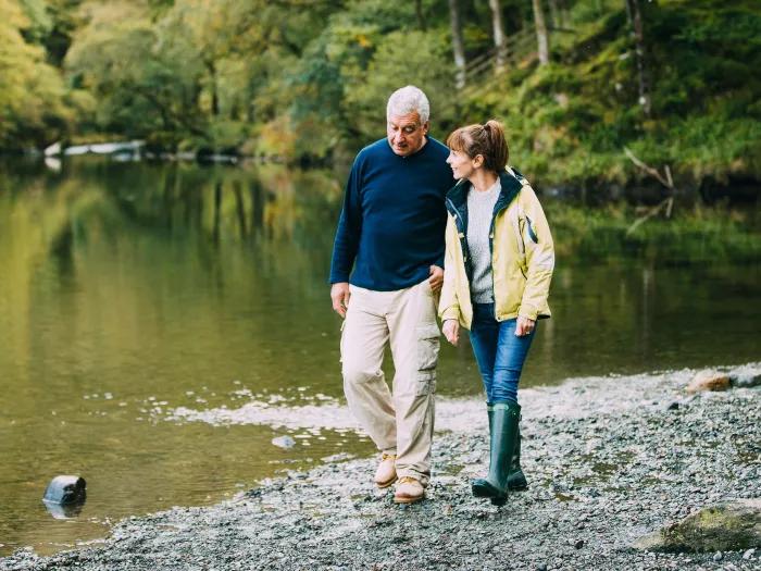 couple walking by the water