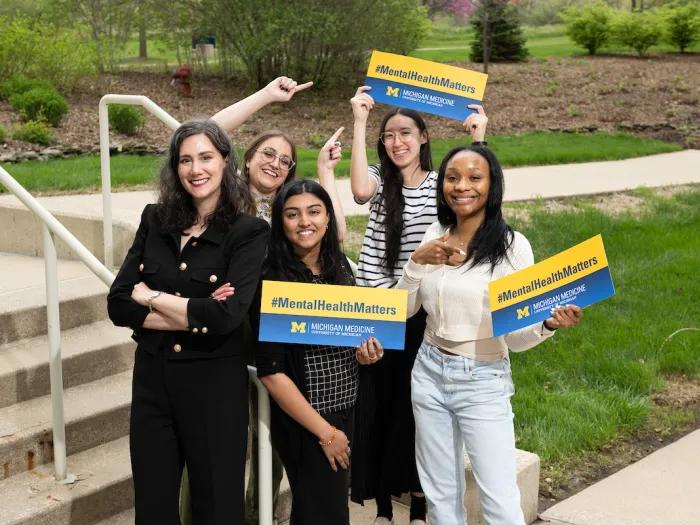 Psychiatry colleagues holding "Mental Health Matters" signs