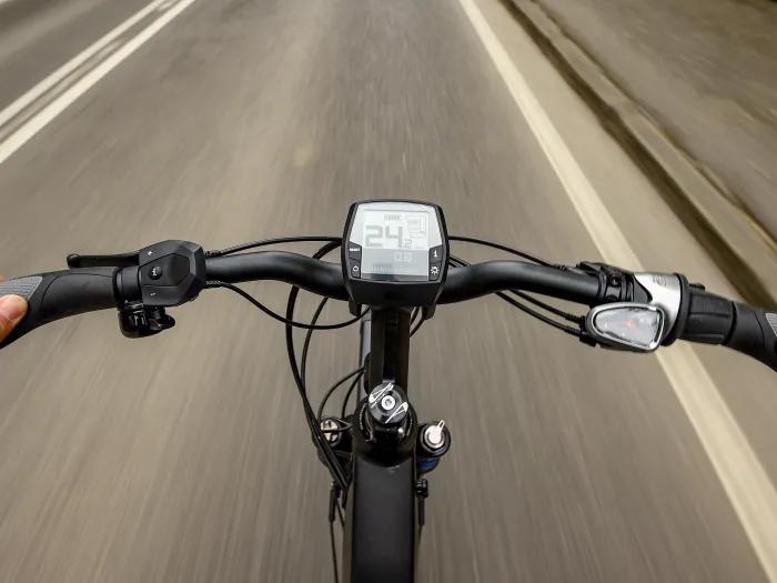 e-bike handles on road close up 