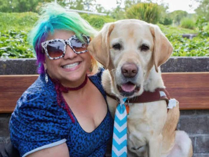 woman with dog smiling
