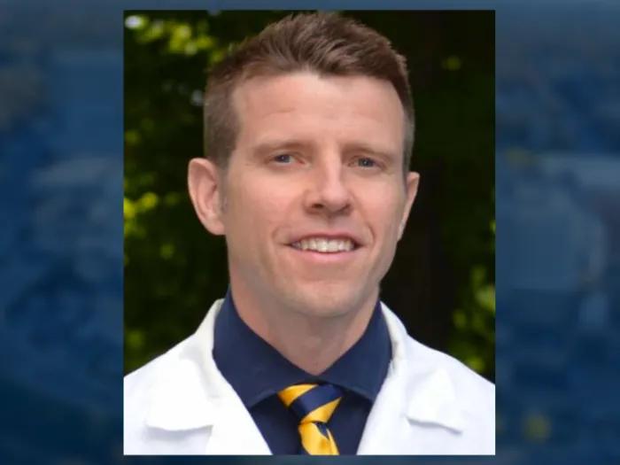 Formal portrait in white coat