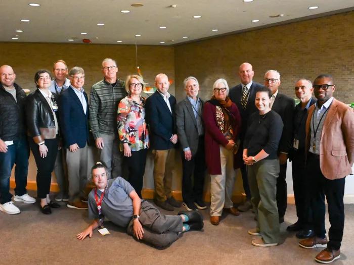 Group of Faculty, including retirees pose for a group photo