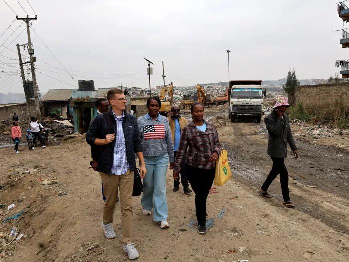 Eric Cooper with U-M Nursing student Noeline Cheruto and representatives from International Samaritan at the Dandora site in Nairobi, Kenya.