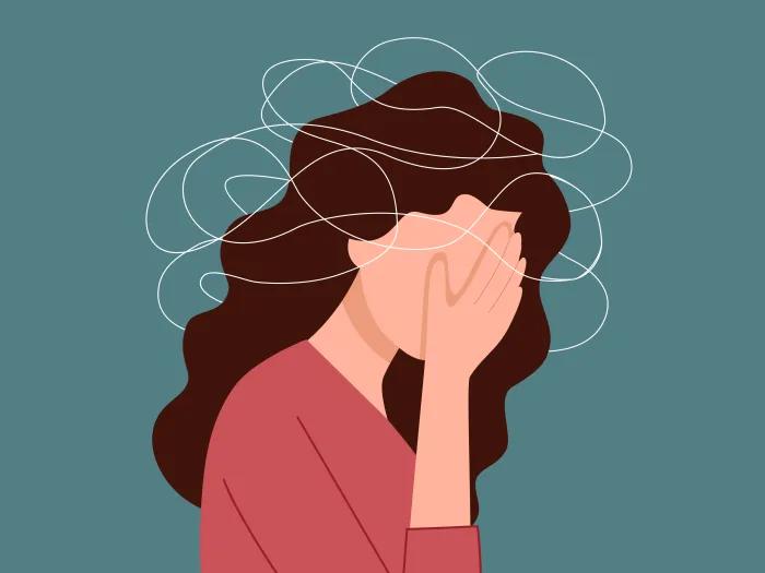 woman with hand covering face