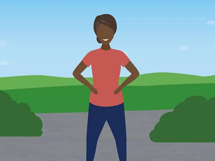 woman standing with hands on hips in front of green grass and blue sky