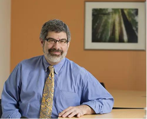 Dr. Rosen sitting at a table