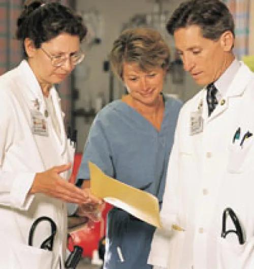 Dr. Barsan with another physician looking at a chart