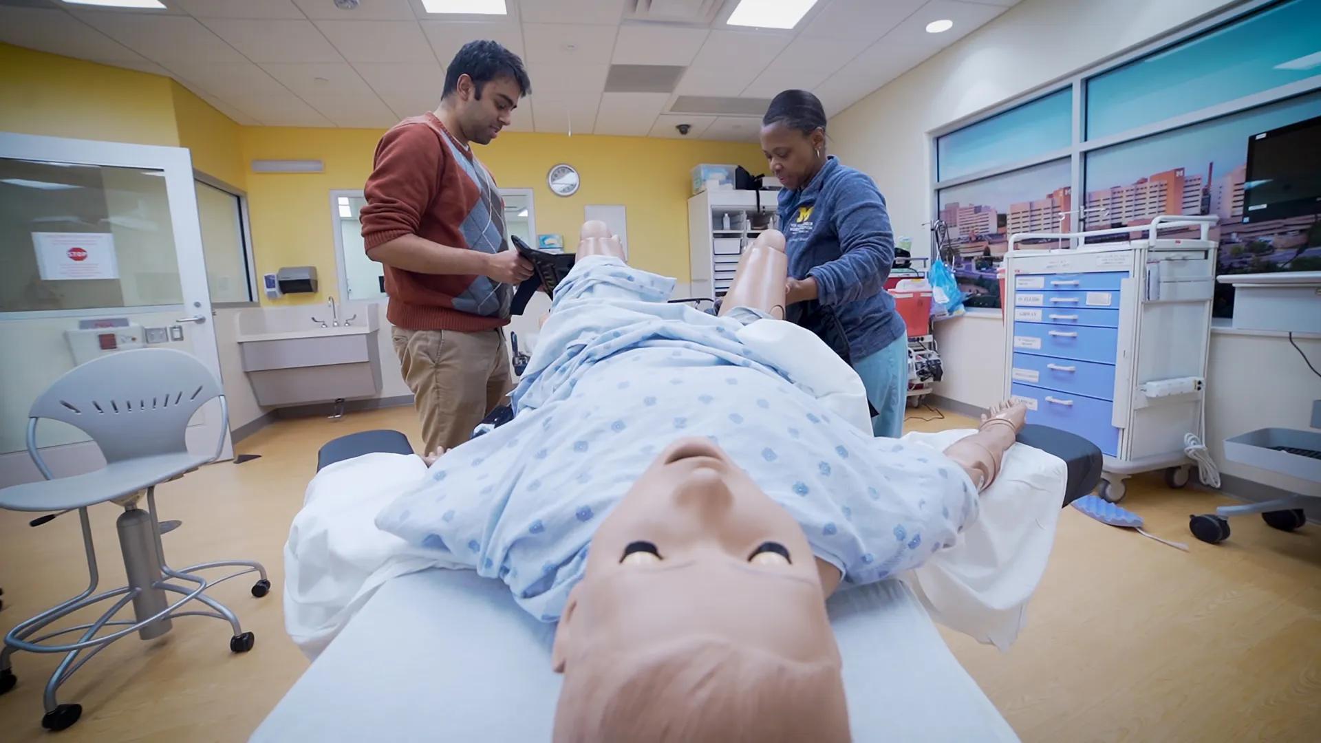 students delivery procedures practicing delivery procedures on a simulation doll 