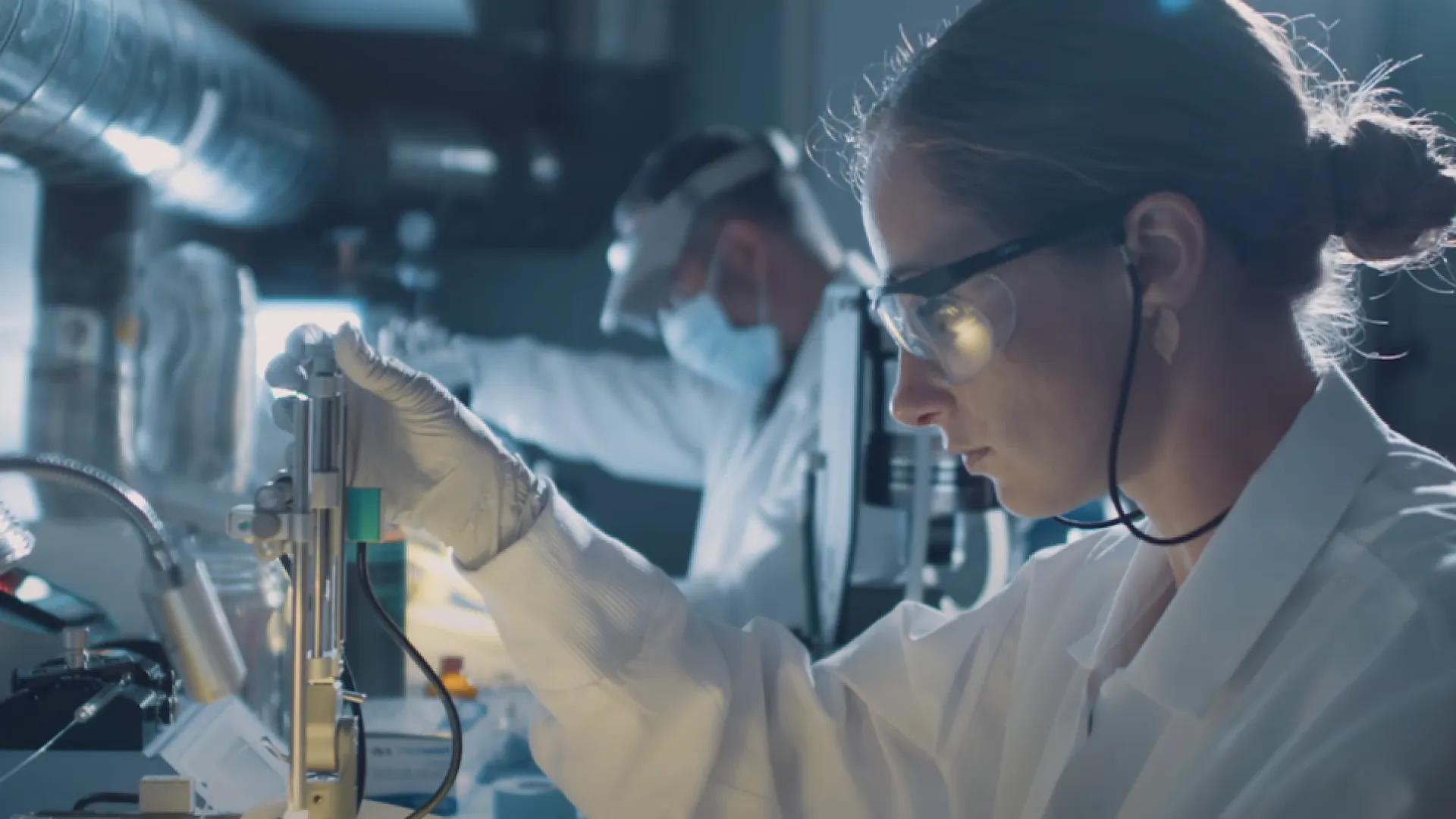 An NGP researcher works with equipment