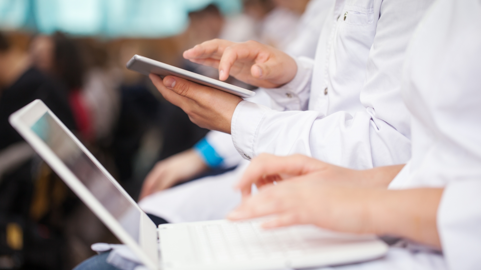 Close-up of medical professionals using electronic devices