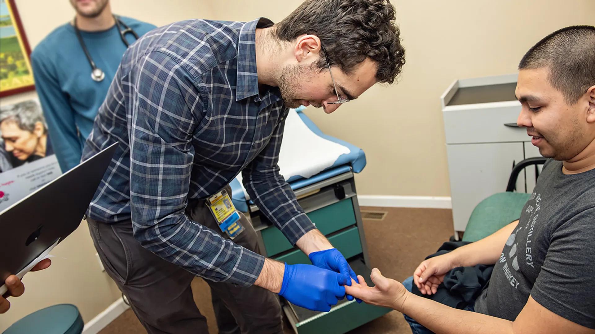 A medical student with a patient