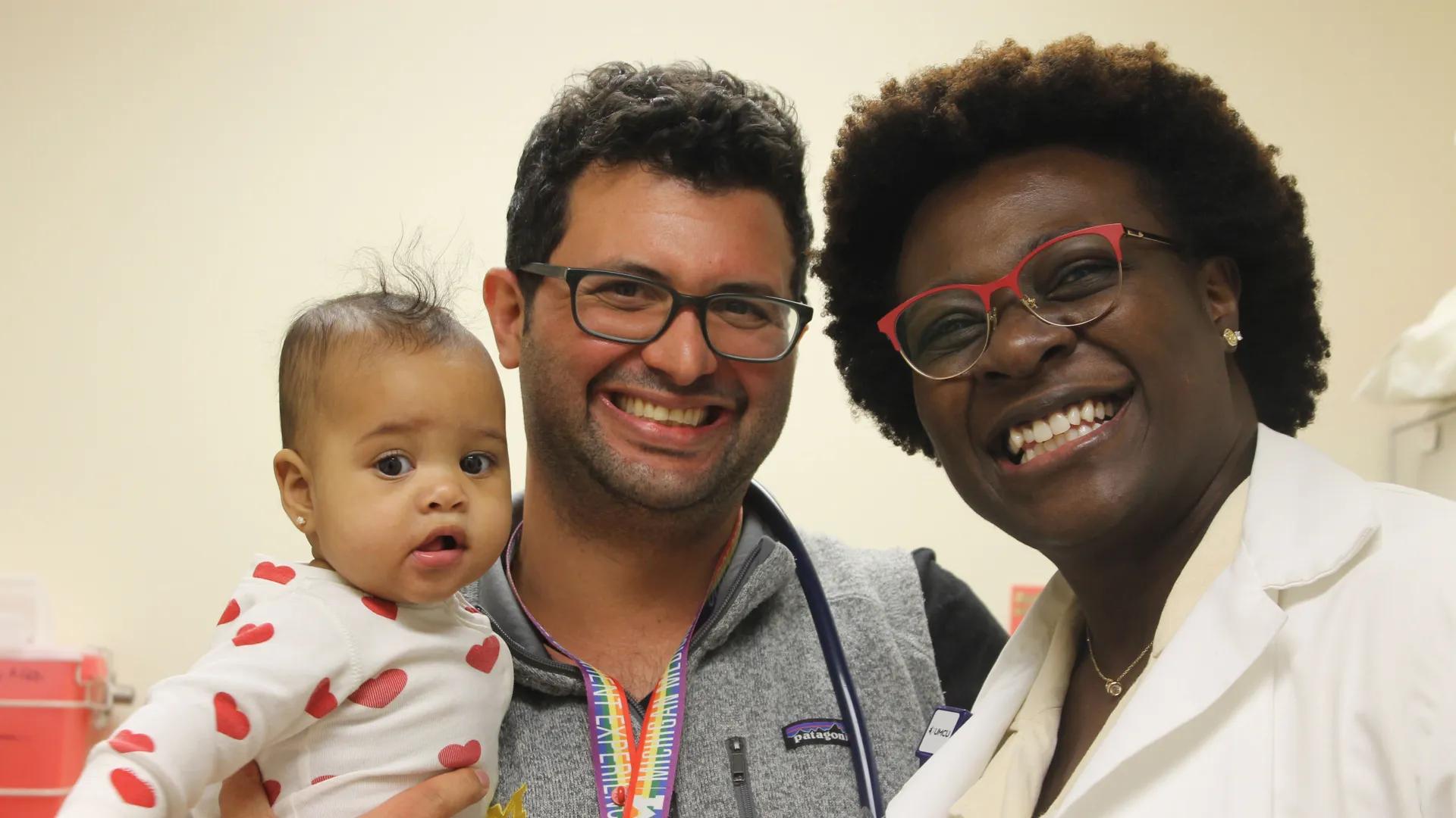 Family medicine team members and baby