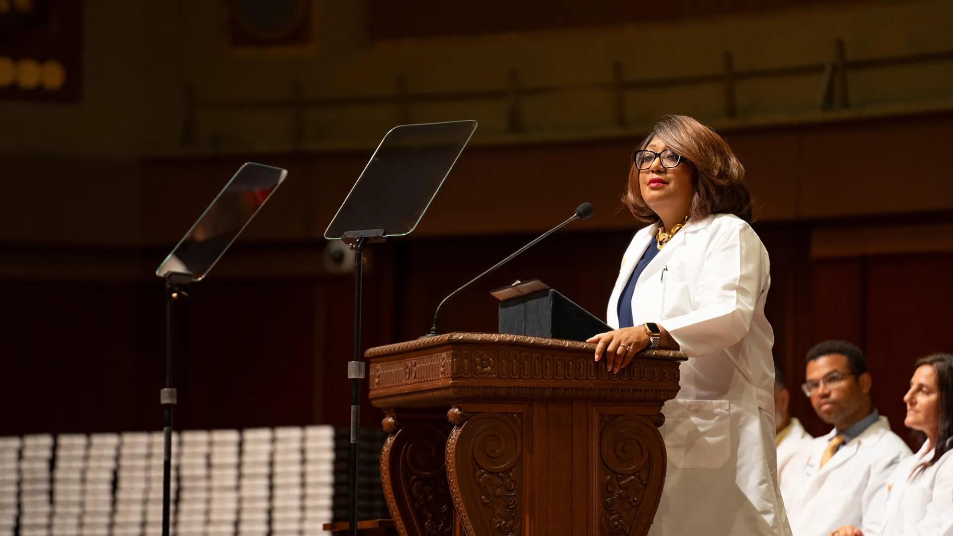 white coat ceremony, faculty at podium