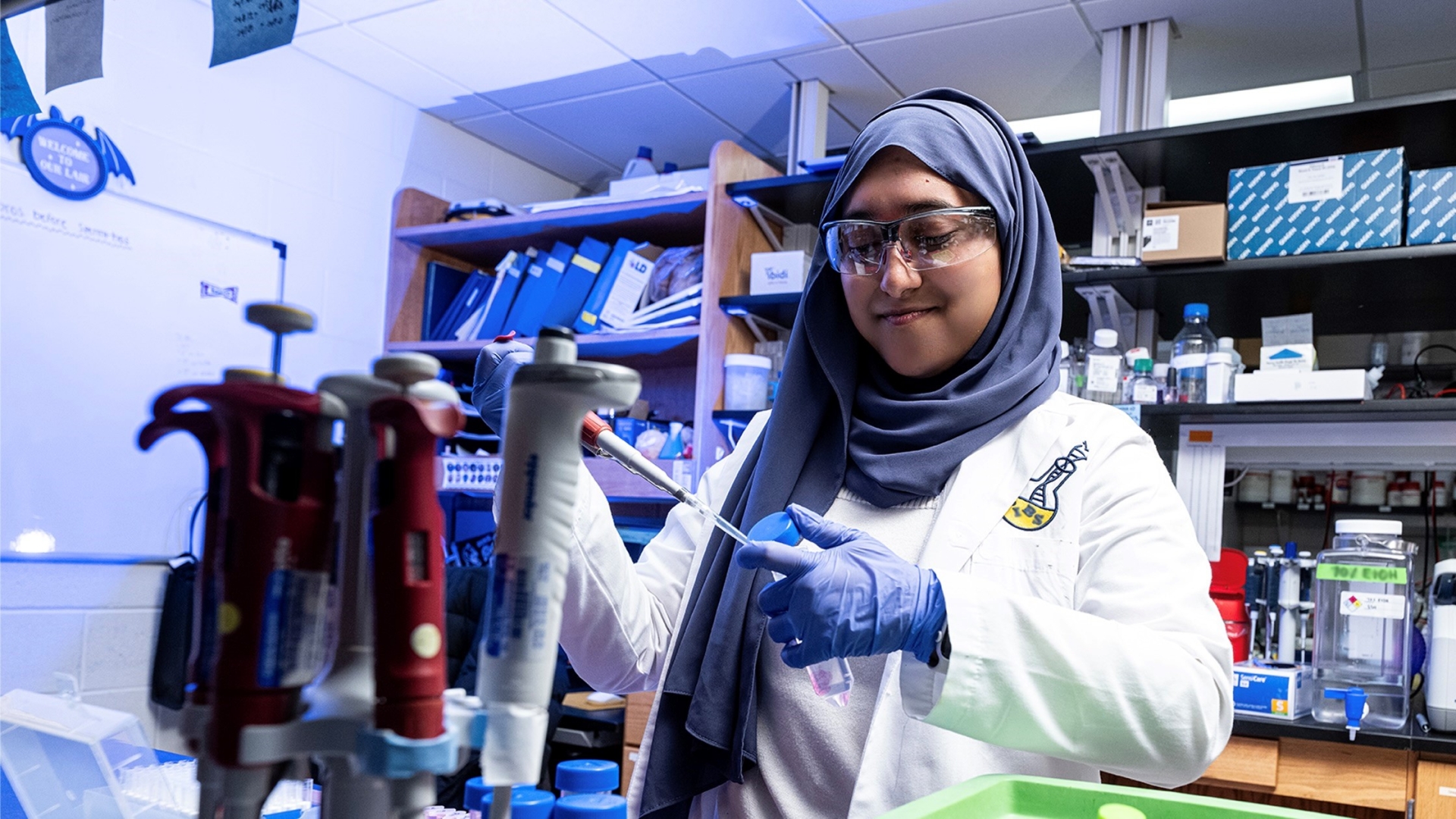 Scientist doing an experiment at the bench