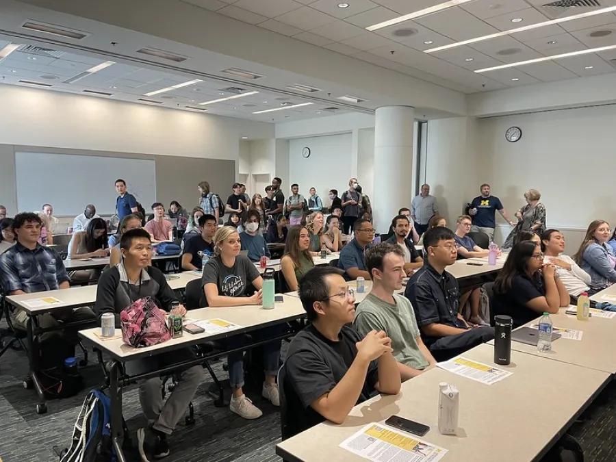 Students attend a lecture at the graduate program kickoff event