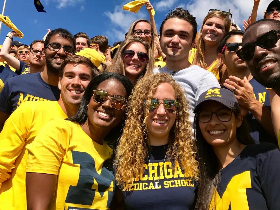 Students celebrating at a Michigan game