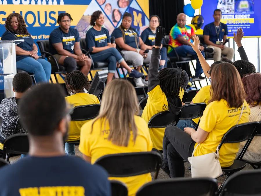 Student at big house youth summit wearing yellow and blue shirts