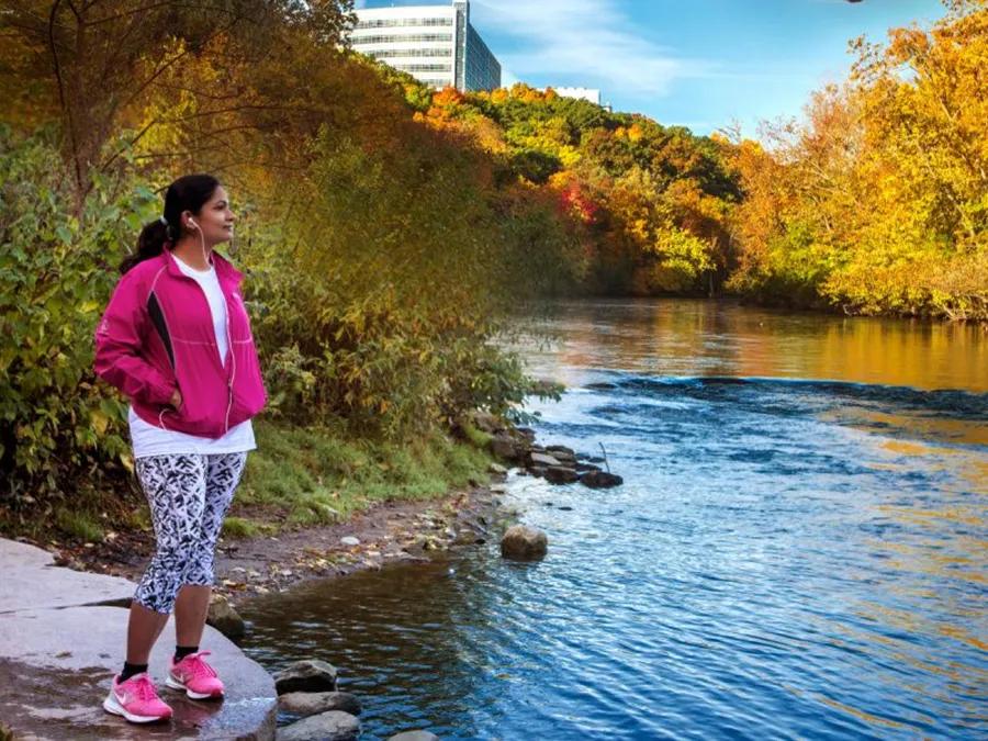 A person standing at a river