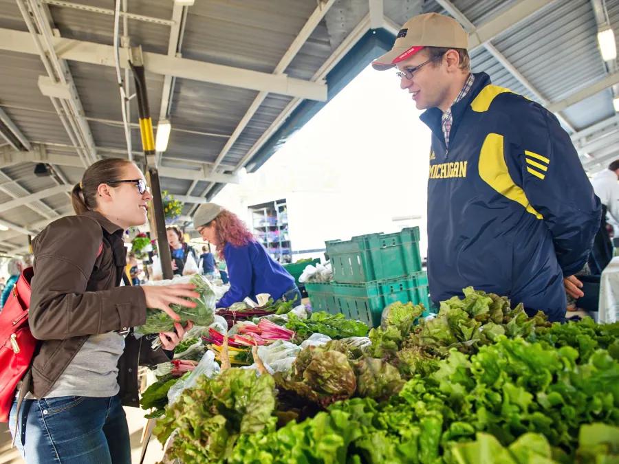 Two people at a farmer's market