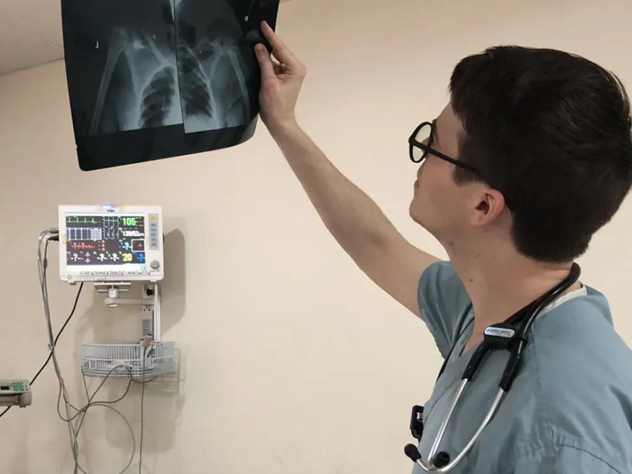 Josiah Smiley looking at an x-ray film