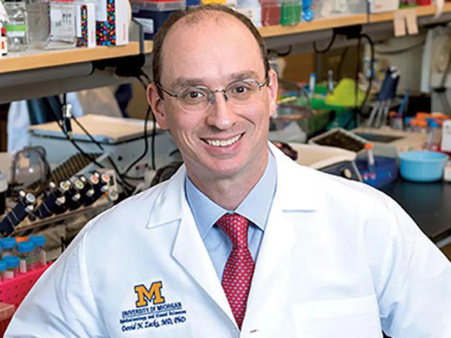 David N. Zacks, M.D., Ph.D., seated in a laboratory.