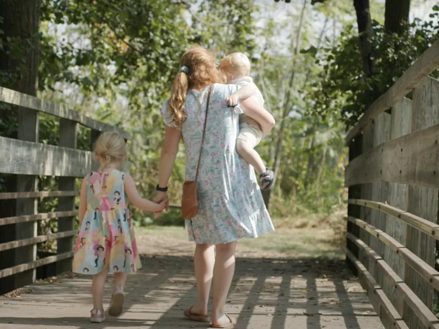 Dr. Wagner walks on a path with her two children