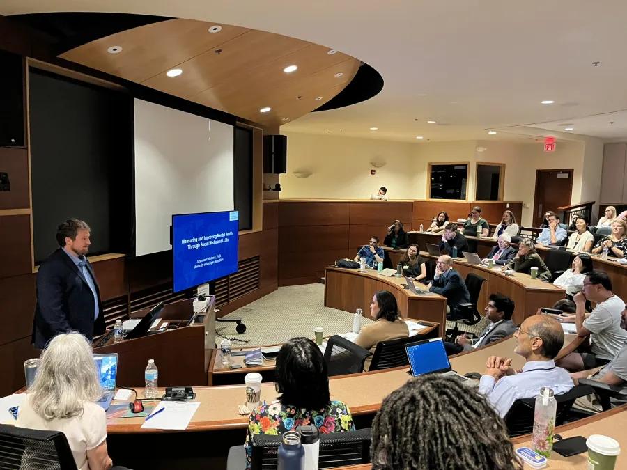 A group of people in a lecture room