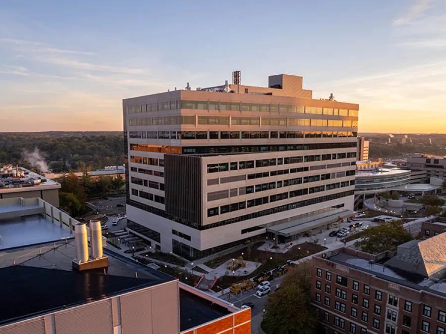 U-M Pavilion building with sunset in the background