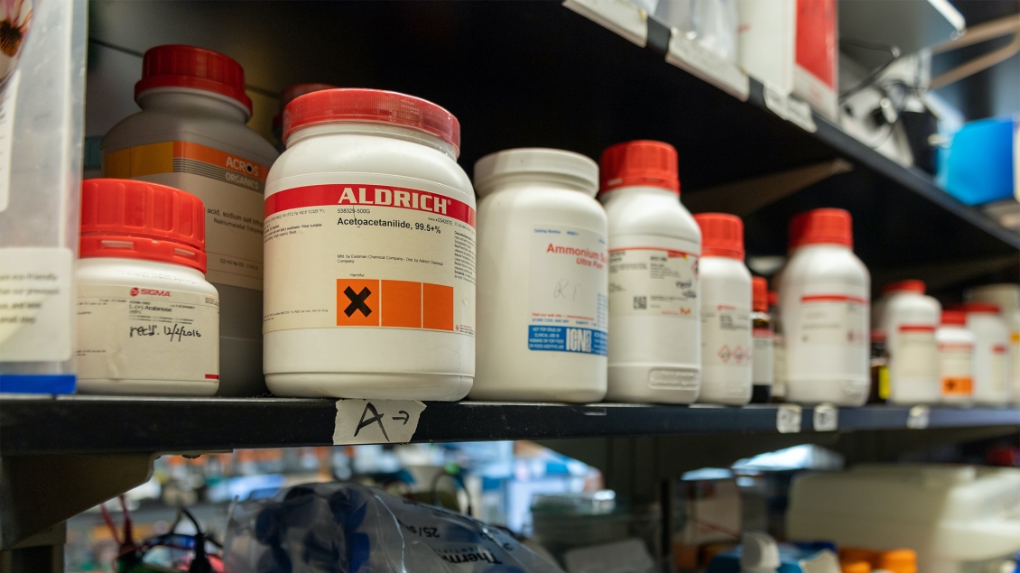 close up view of Aldrich chemicals on a shelf 