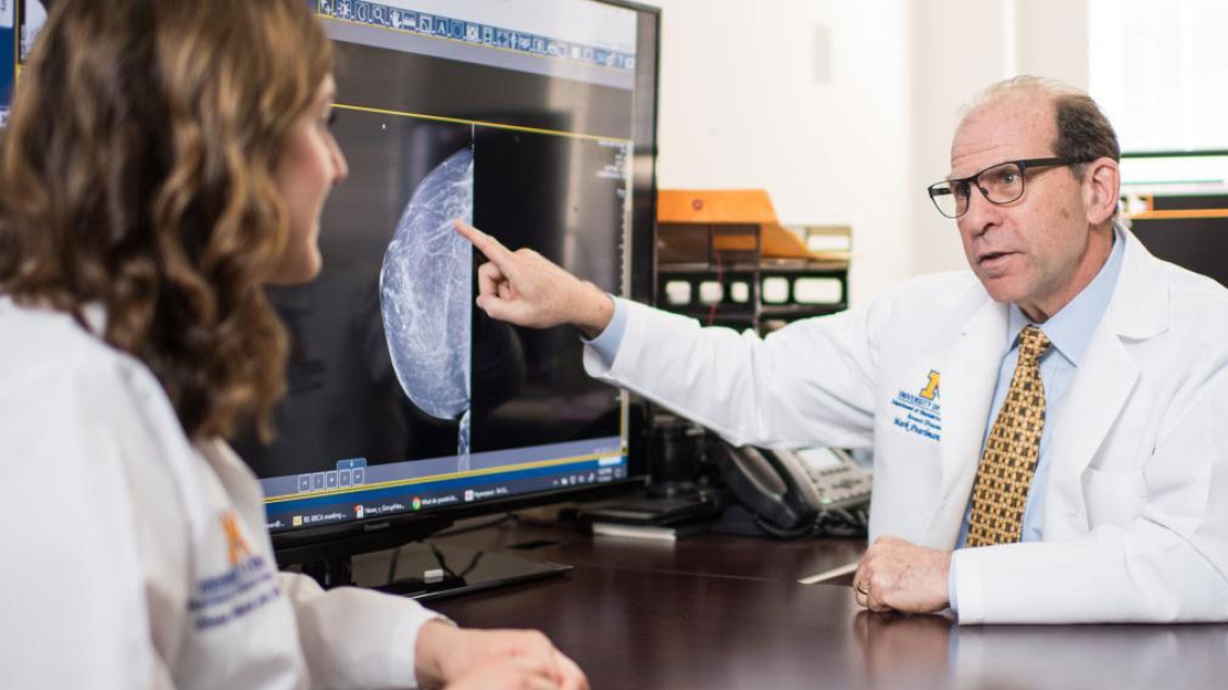 OBGYN faculty member pointing to diagnostic image on screen