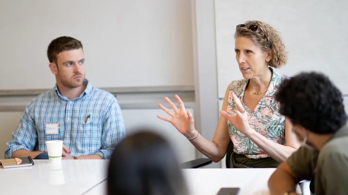 People sitting around a table in discussion