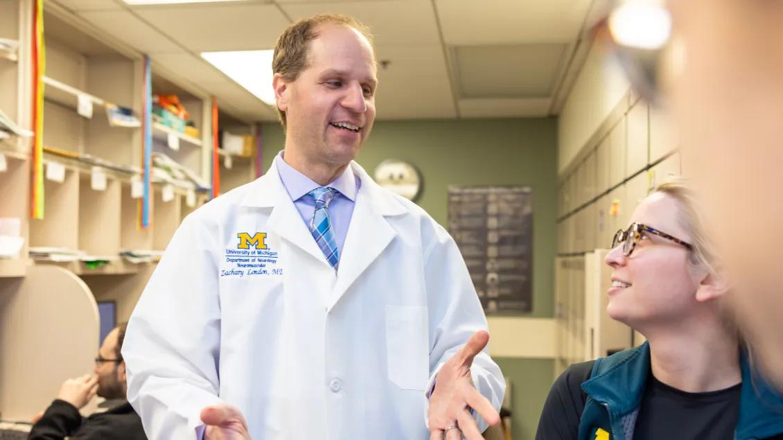 Doctor explains teachings to other residents