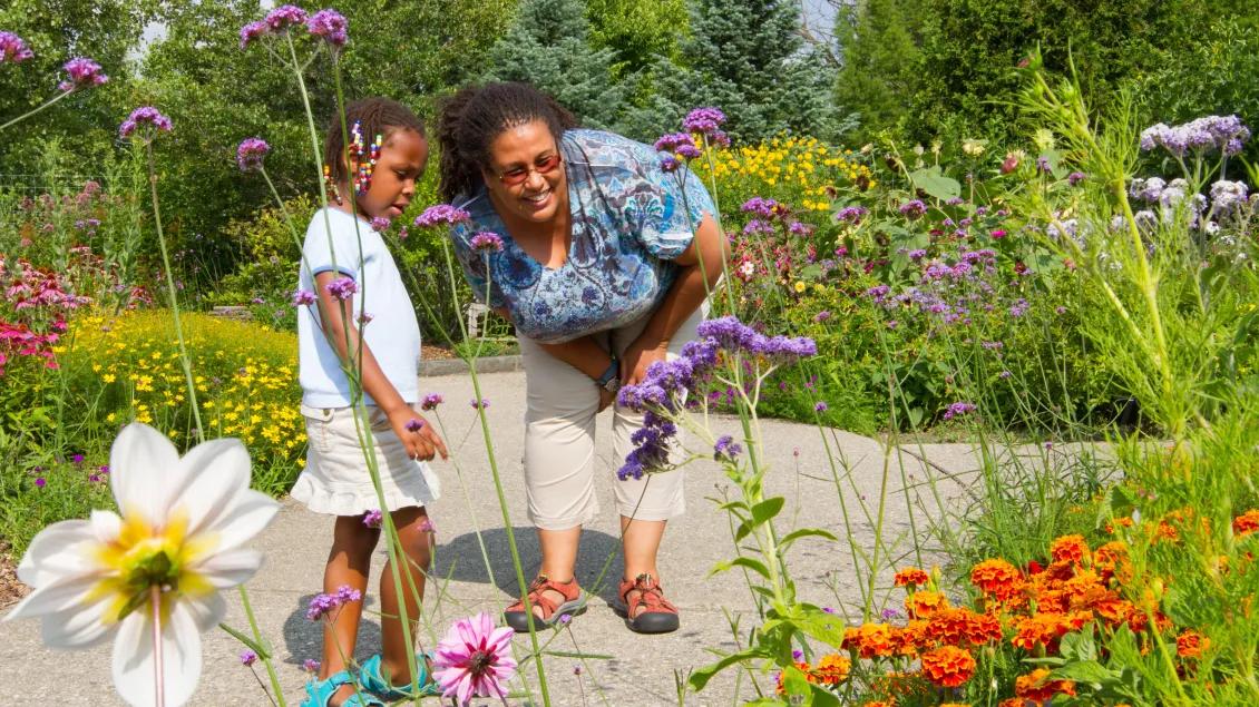 A woman and girls enjoying the gardens