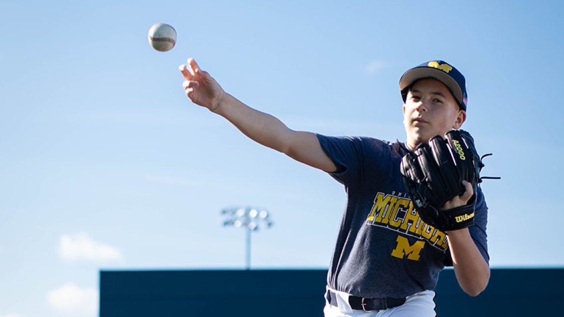  boy throwing baseball