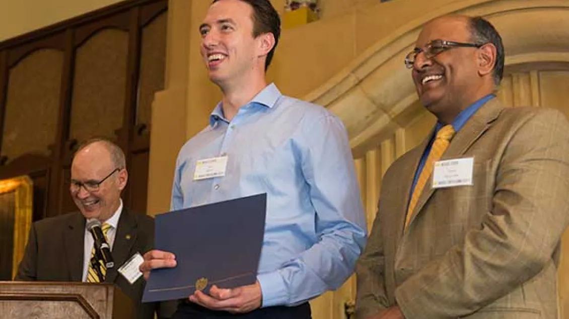 Student accepting award at the Graduation Awards Luncheon and Awards Ceremony