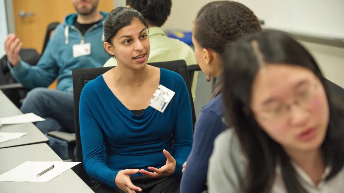 Students having conversations at UMMS workshop