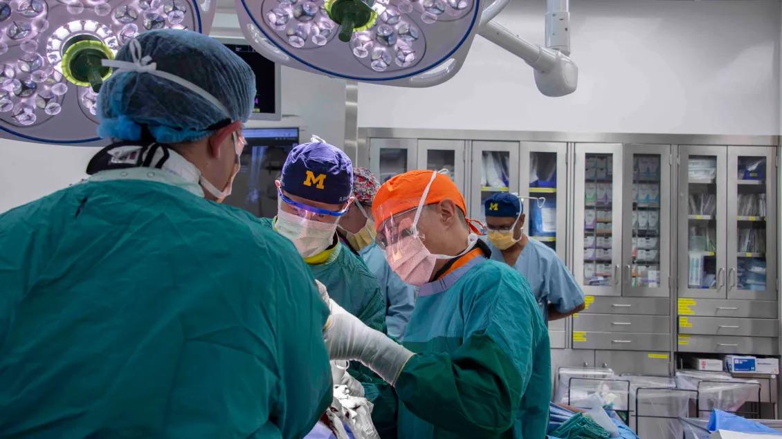 a group of surgeons in a operating room