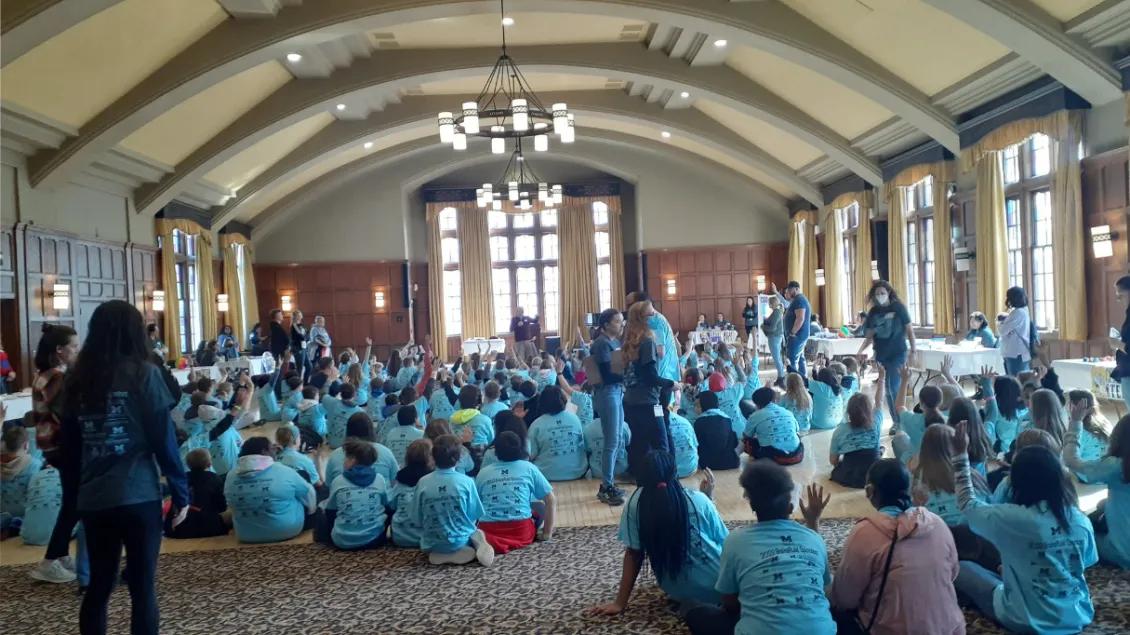 Middle school students from Michigan Schools gather to listen to opening announcements at the Michigan League, March 9th, 2023.