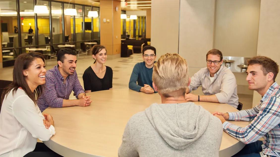 A group of people at a table talking