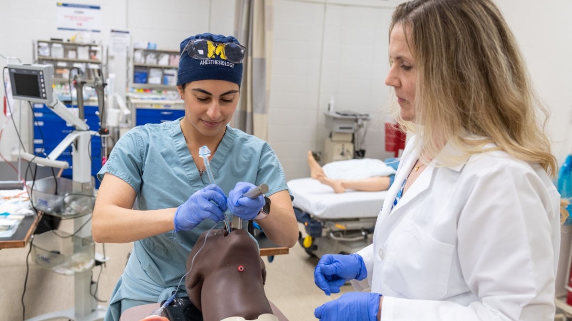 Anesthesiology resident works in the simulation lab