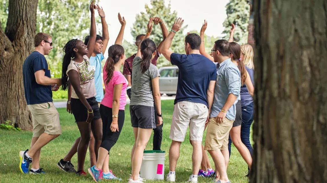 A group of people celebrating outside