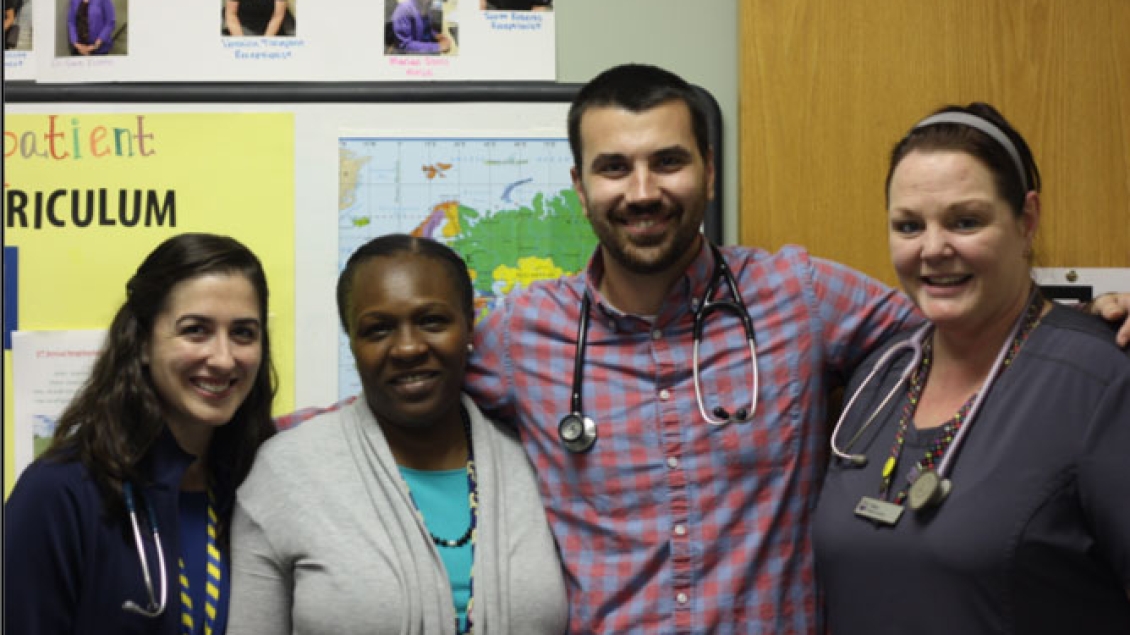 ambulatory care workers smile for a photo