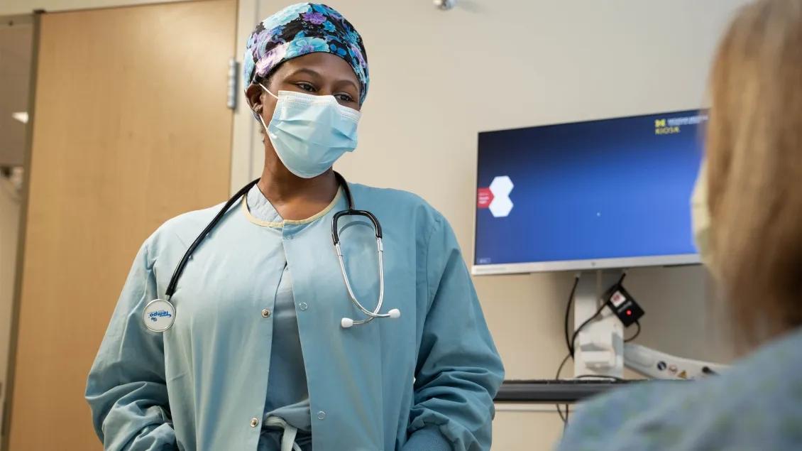 A doctor speaking with a patient