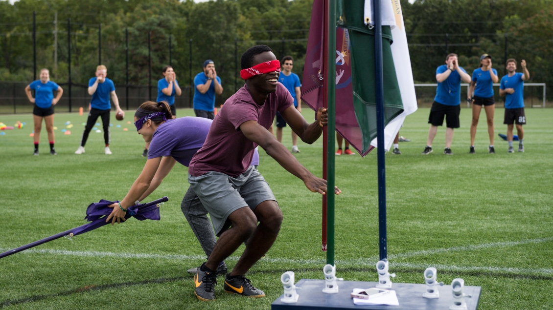 Students play capture the flag during an M-Home event