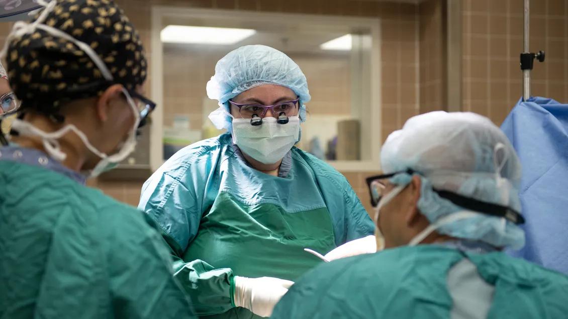 view of surgeon looking across operating table 