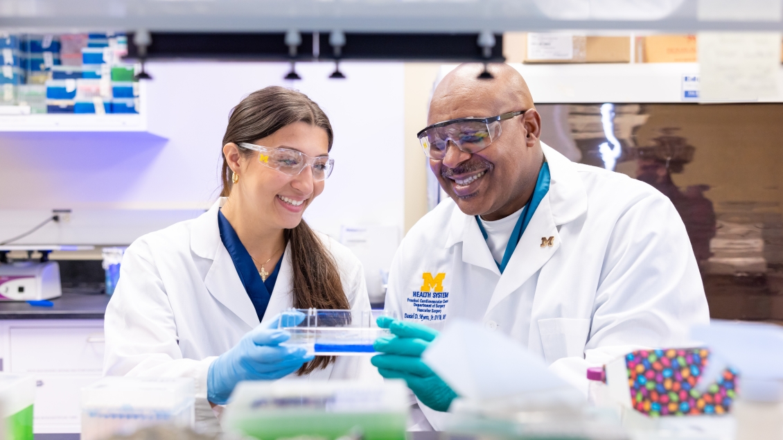 Girl talking to lab professional 