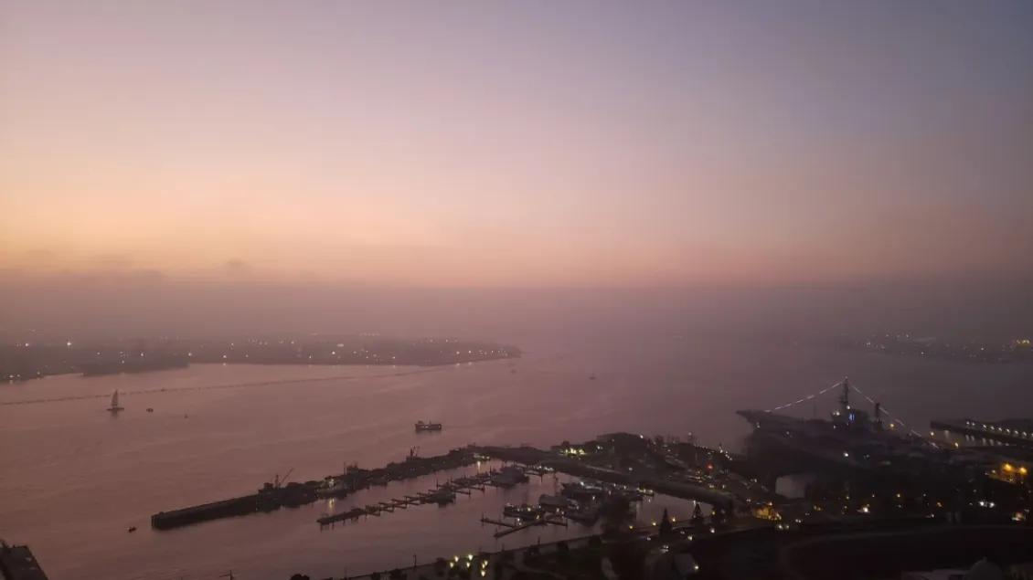 Aerial view of a city port in the late evening