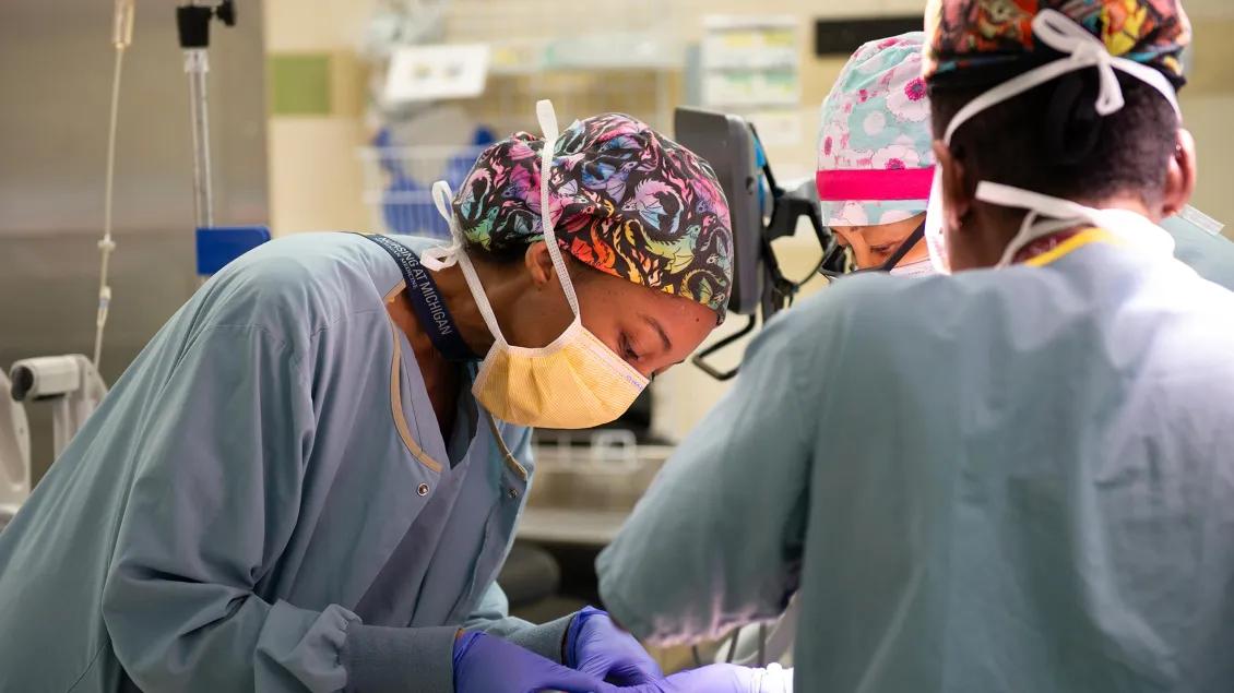 Surgeon operating on patient in OR