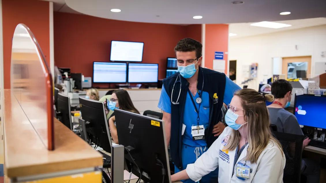 residents working on computers in the hospital