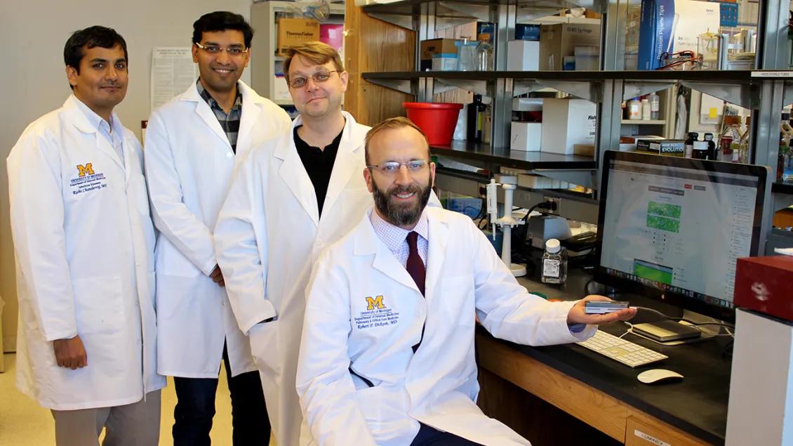 A group of faculty members in an office
